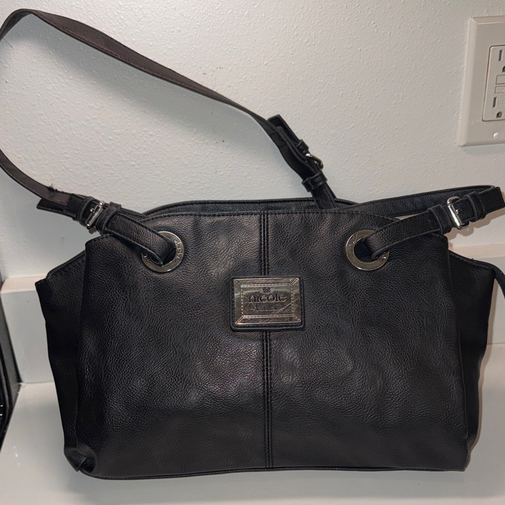 Nicole Miller Black Leather Tote with Silver Accents and Hot Pink Interior